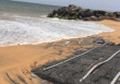 Use of geo-textile fabric and pervious concrete to prevent coastal erosion in sandy soil beaches of Kerala